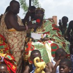Akuapem Mamponghene (Chief) siting in state at a durbar, addressing community on girls and young women empowerment for development during a courtesy call on him by female students from University of Ghana mobilised by CRRECENT to press home the importance of young women empowerment for development. 